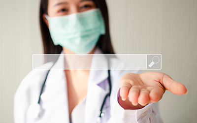 Medical professional with mask holding serach bar concept